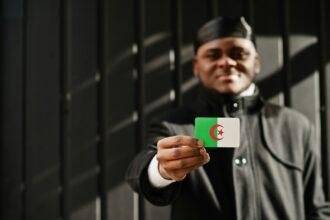Young african man hold flag