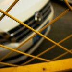 a close up of a car behind a fence